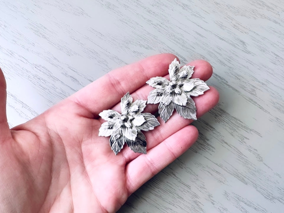 1950s Vintage Silver Maple Leaf Earrings by Sarah Coventry from Piggle and Pop shown in hand for visual size reference
