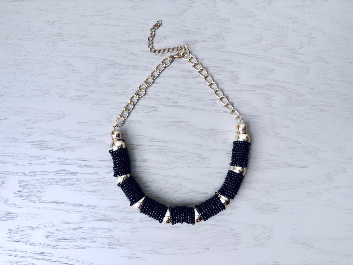 Vintage black and gold beaded coil necklace from Piggle and Pop