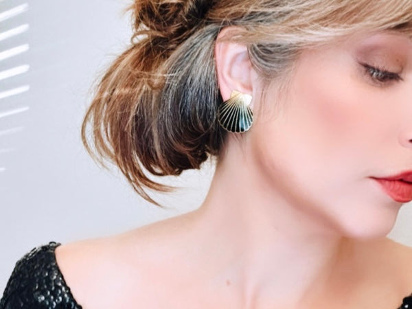 Bethan Jayne modeling Vintage black and gold enamel clip on shell earrings from Piggle and Pop