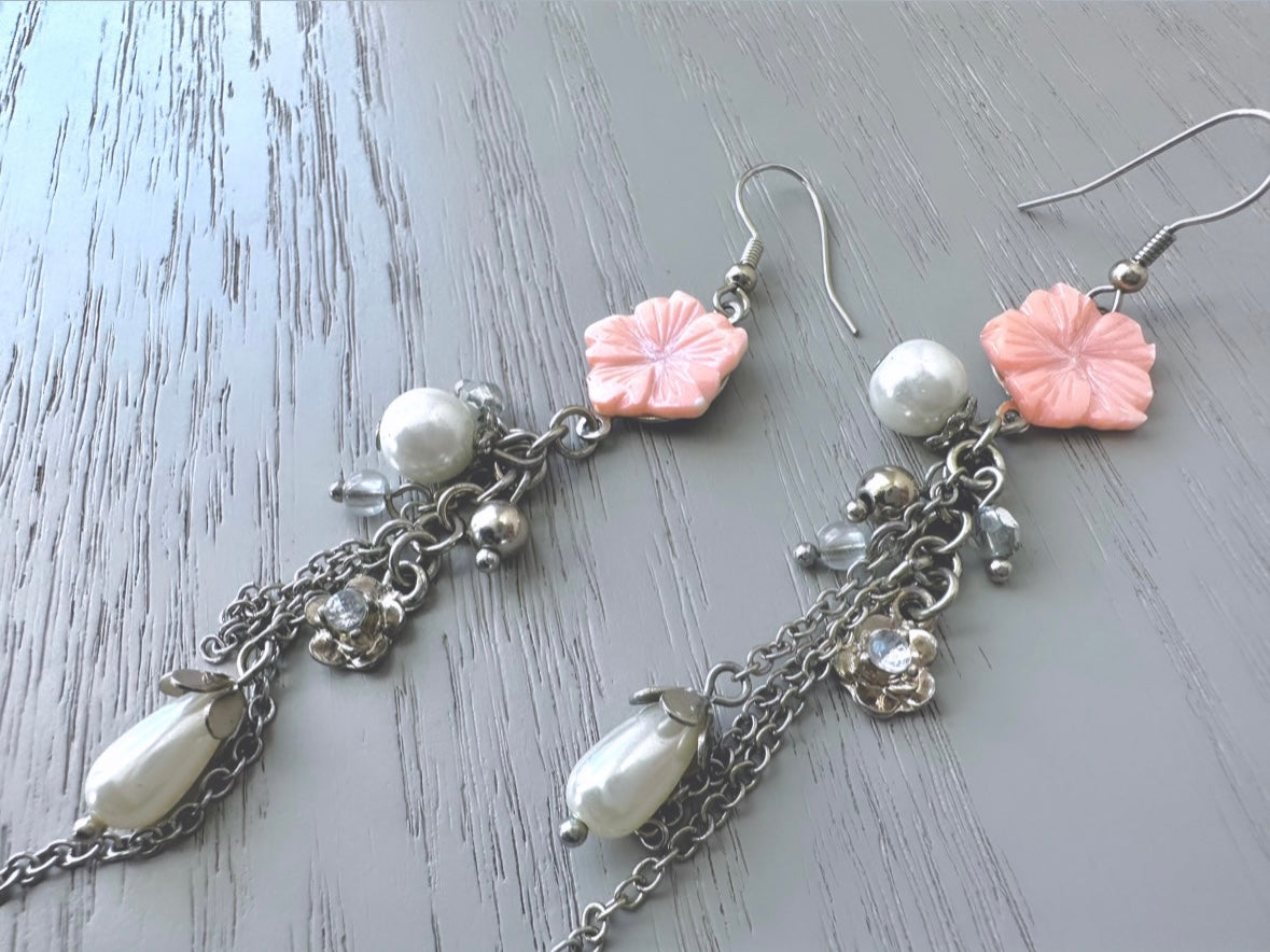 Close up of 1990s Silver and Pink Flower Dangle Earrings from Piggle and pop