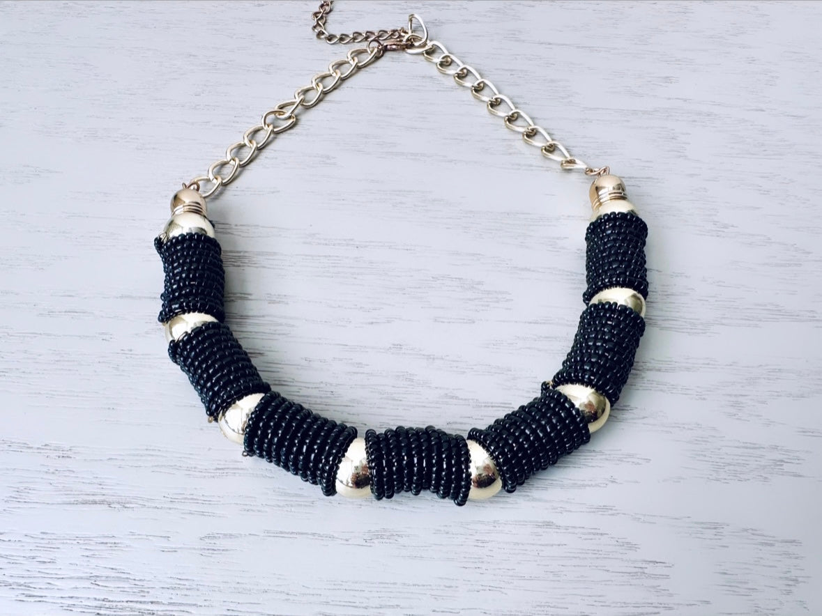 Vintage black and gold beaded coil necklace from Piggle and Pop