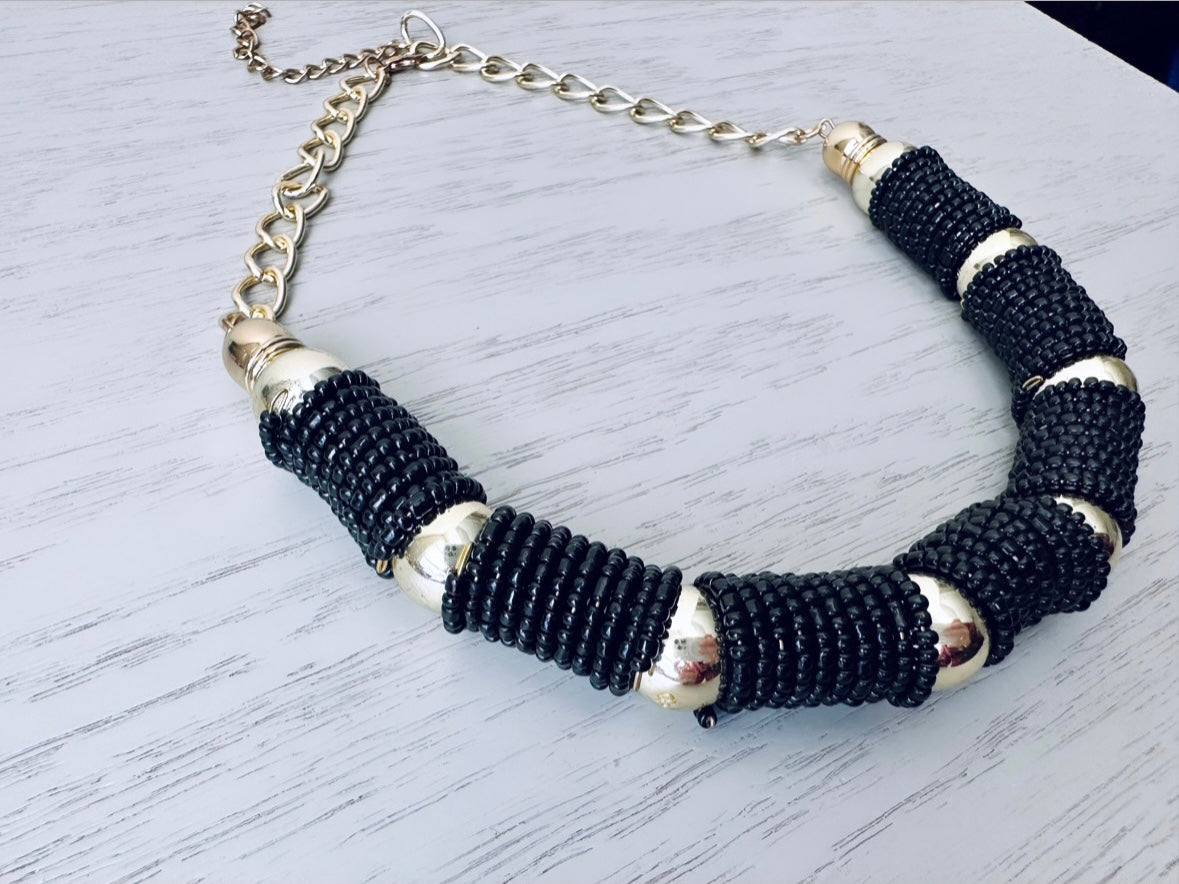 Vintage black and gold beaded coil necklace from Piggle and Pop