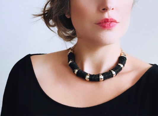 Vintage black and gold beaded coil necklace from Piggle and Pop